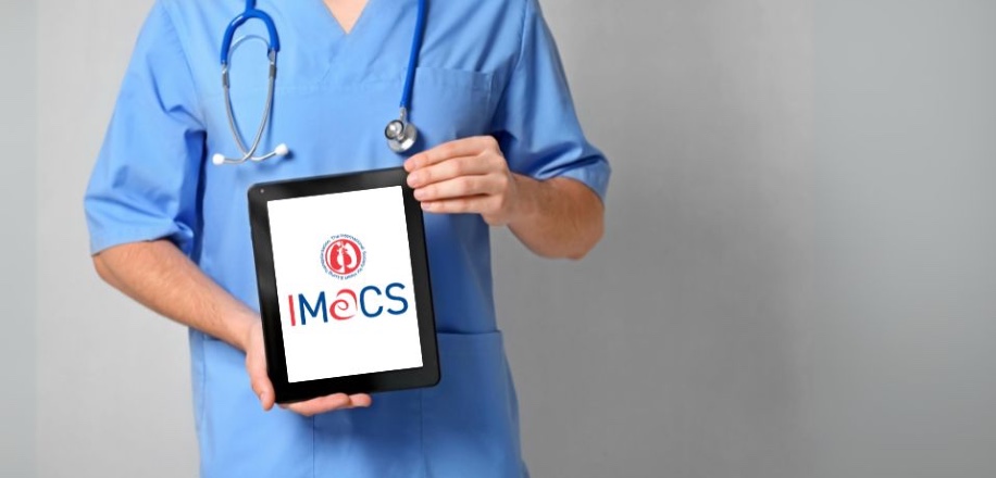 Photo of a person in scrubs holding a tablet with the IMACS Registry logo on it