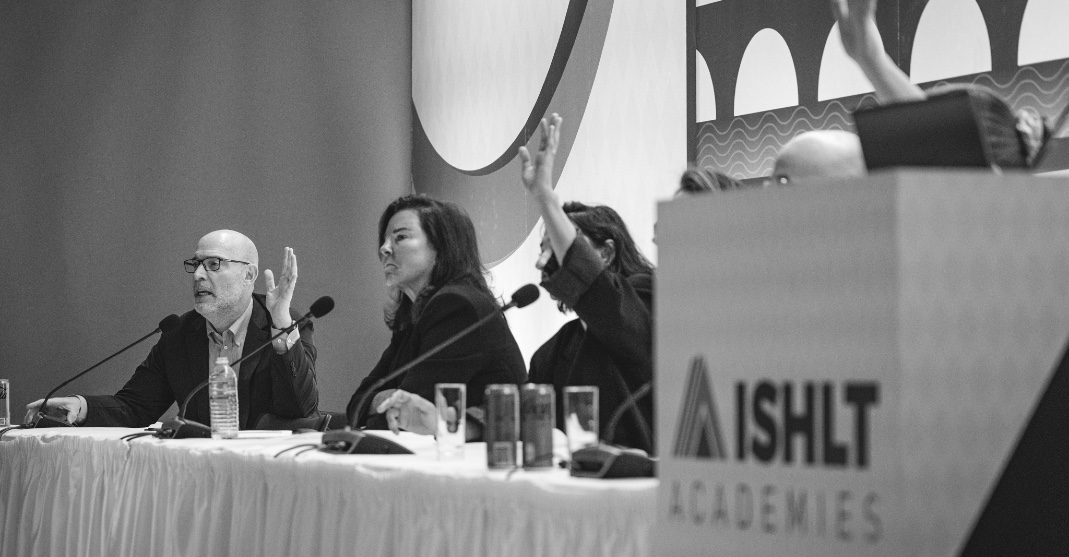 Black and white photo of people voting