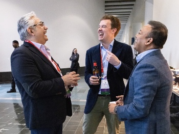 Three men laughing at the ISHLT2025 Early Career Reception