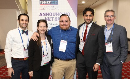 Five people smiling for the camera at an ISHLT event