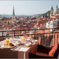 Photo of table with food overlooking Prague