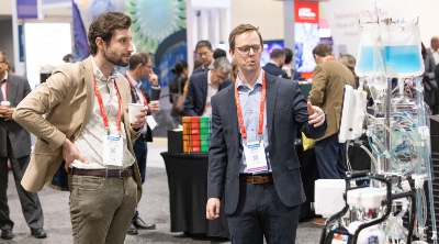 Men looking at medical device in the ISHLT2026 Exhibit Hall