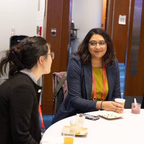 Photo of two people at the ISHLT2026 First Time Attendee Orientation and Breakfast