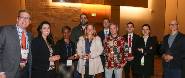 A group of Anesthesiology and Critical Care representatives smiling at a reception at ISHLT2023 in Denver