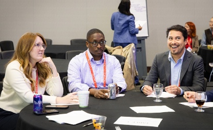 Group working together with person writing on board in background