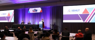 The stage at the 2023 Academies including the panel and one featured speaker