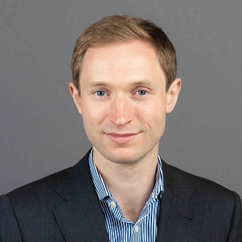 Headshot of Ross Thomson