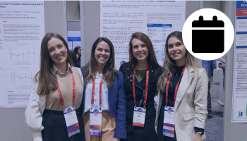 Photo of women smiling in the poster hall at ISHLT2025